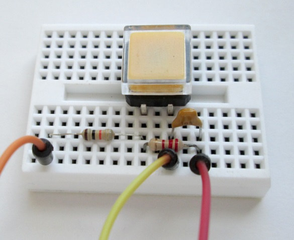 Push switch with debouncing circuit on breadboard