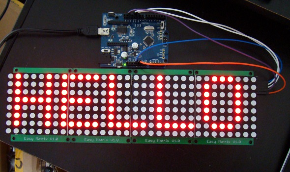 Four Easy Matrix modules cascaded together and driven by Arduino Uno