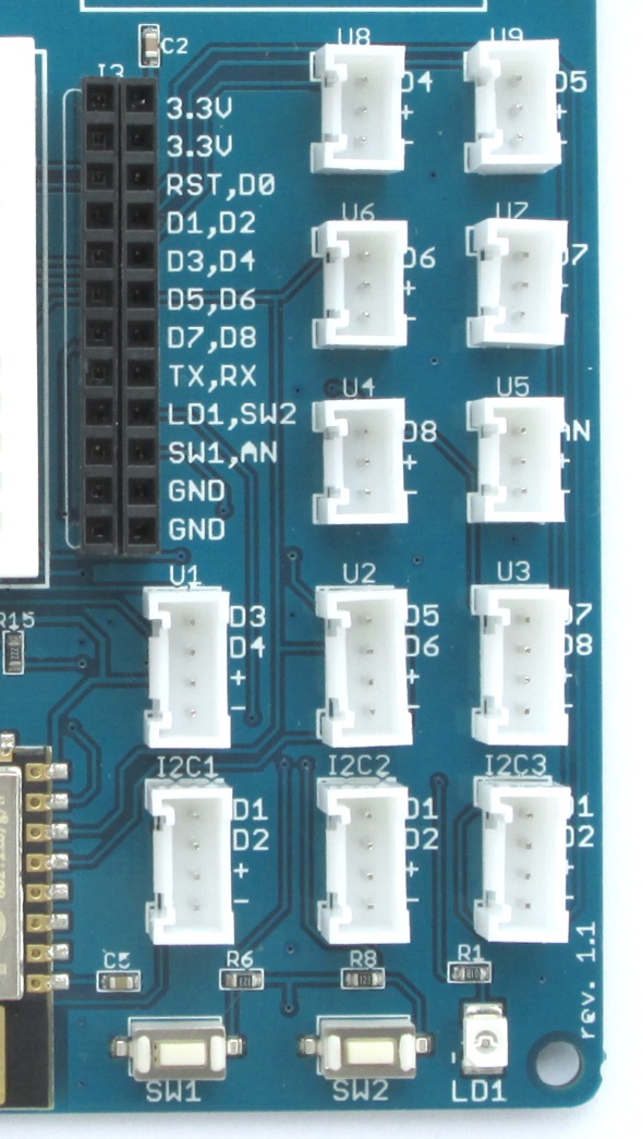 A 2×12 female header (J3) and grove connectors provide access to the ESP12E I/O pins and the user switches and LED.